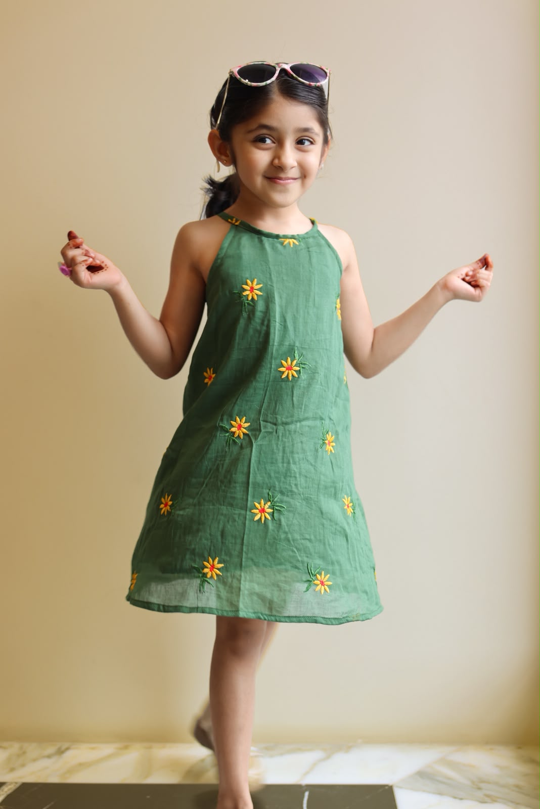 Green dress with daisy embroidery